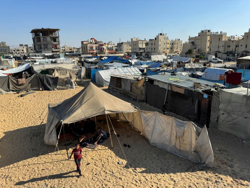 Displaced Palestinians, who fled their house due to Israel's military offensive, shelter in a tent, in Rafah, in the southern Gaza Strip