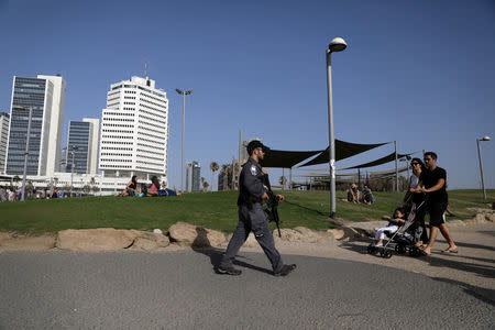 Israeli policeman patrols the area near the beach on the eve of the 2019 Eurovision song contest final in Tel Aviv, Israel May 18, 2019 REUTERS/ Ammar Awad