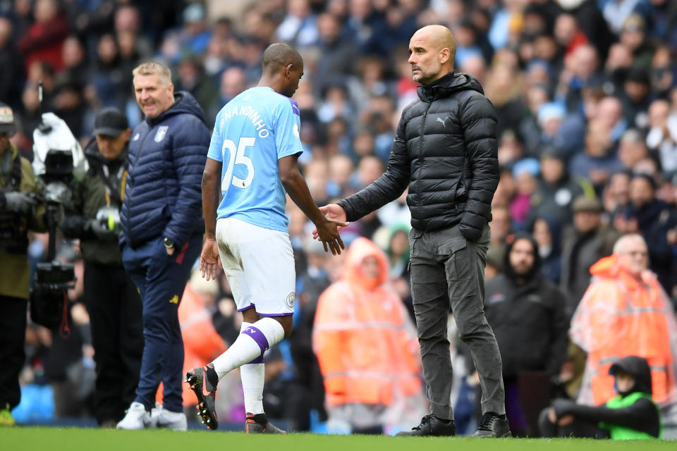 MANCHESTER, ENGLAND - OCTOBER 26: Pep Guardiola, Manager of Manchester City greets Fernandinho of Manchester City as he leaves the pitch after receiving a red card during the Premier League match between Manchester City and Aston Villa at Etihad Stadium on October 26, 2019 in Manchester, United Kingdom. (Photo by Michael Regan/Getty Images)