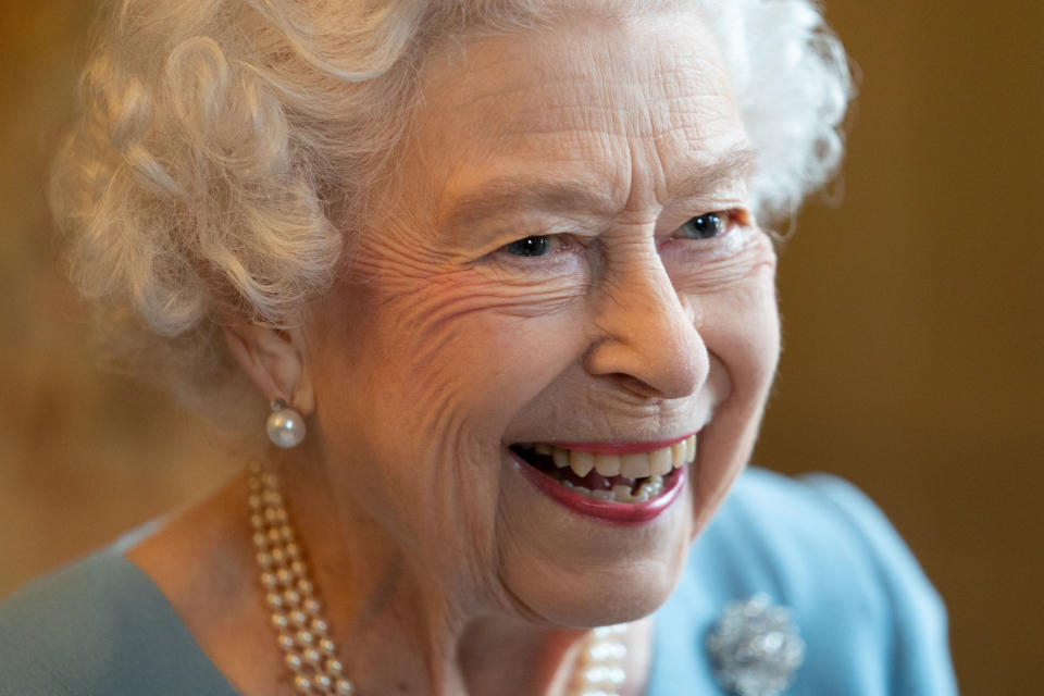 Britain&#39;s Queen Elizabeth II smiles during a reception in the Ballroom of Sandringham House, the Queen&#39;s Norfolk residence on February 5, 2022, as she celebrates the start of the Platinum Jubilee. - Queen Elizabeth II on Sunday will became the first British monarch to reign for seven decades, in a bittersweet landmark as she also marked the 70th anniversary of her father&#39;s death. (Photo by Joe Giddens / POOL / AFP) (Photo by JOE GIDDENS/POOL/AFP via Getty Images)