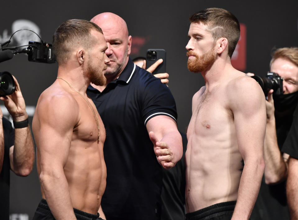 ABU DHABI, UNITED ARAB EMIRATES - OCTOBER 29: (L-R) Opponents Petr Yan of Russia and Cory Sandhagen face off during the UFC 267 ceremonial weigh-in at Etihad Arena on October 29, 2021 in Yas Island, Abu Dhabi, United Arab Emirates. (Photo by Chris Unger/Zuffa LLC)