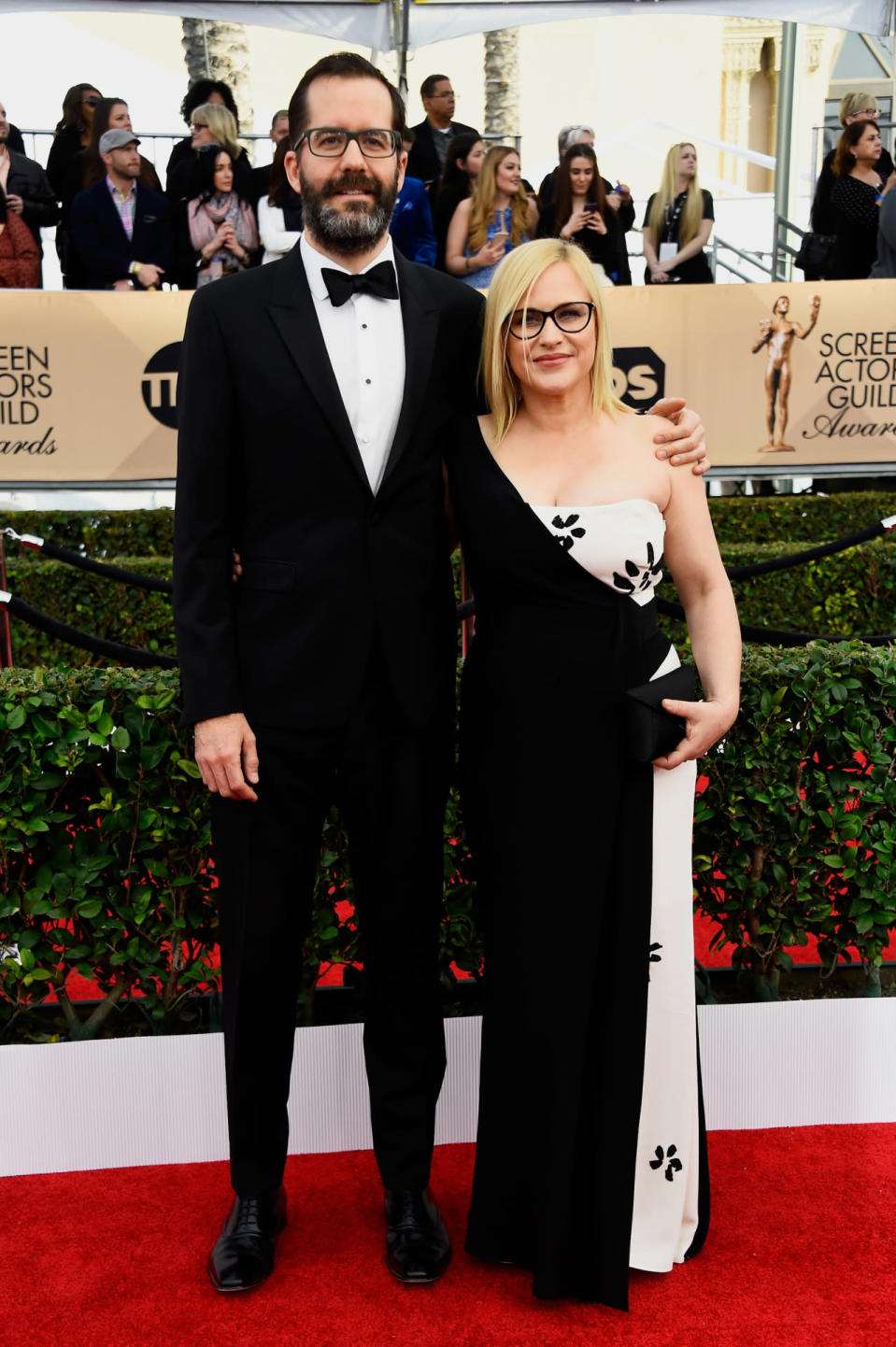 Patricia Arquette in a black and white gown with her boyfriend Eric White at the 22nd Annual Screen Actors Guild Awards at The Shrine Auditorium on January 30, 2016 in Los Angeles, California.