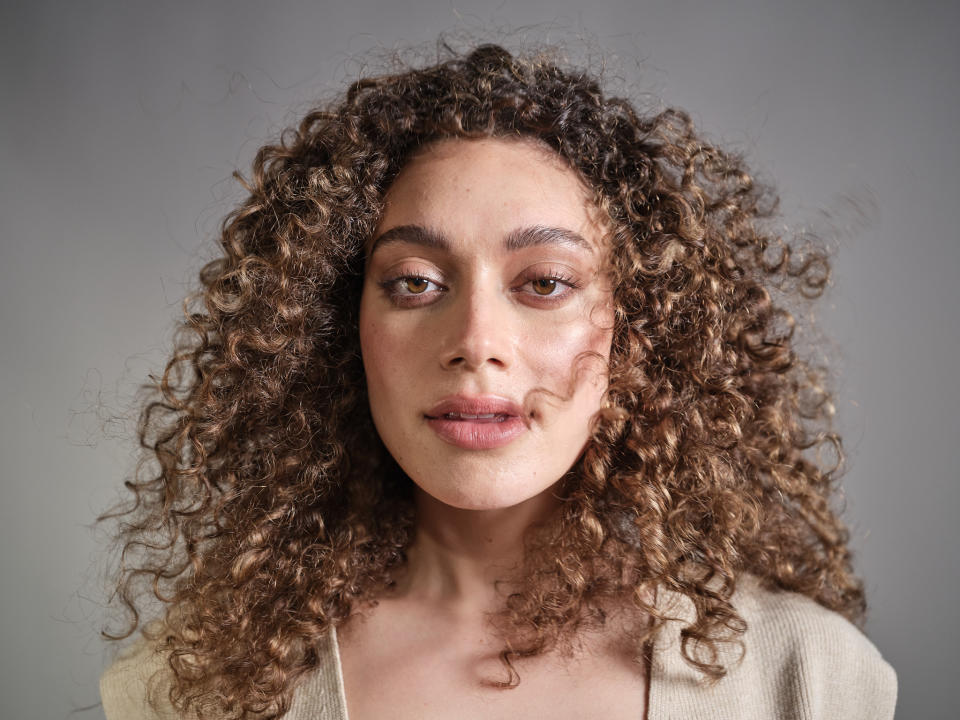 Woman with curly hair coloured with MIIROKO products