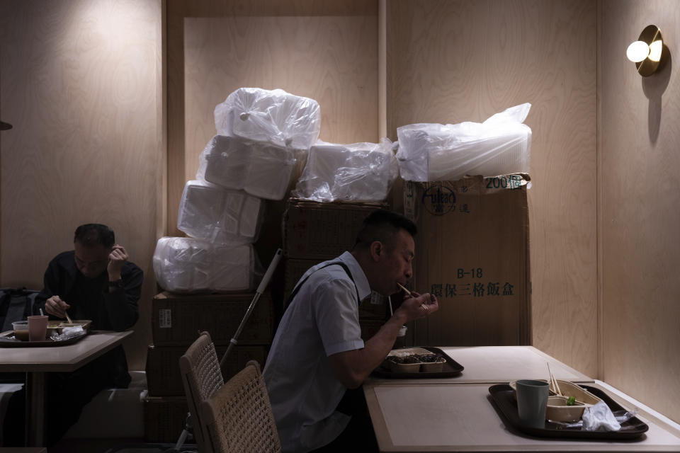 Customers eat food in disposable boxes at Kuen Fat Kitchen, a typical lunch stop, in Hong Kong, Wednesday, April 10, 2024. Hong Kong has long been a major producer and consumer of great food, and a great amount of plastic and Styrofoam to go with it. That’s going to change as new legislation aiming to stop the sale and distribution of Styrofoam products and single-use plastic cutlery went into effect on Monday, April 22, 2024.(AP Photo/Louise Delmotte)