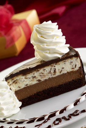 <div class="caption-credit"> Photo by: The Cheesecake Factory</div>Meanwhile, the Chocolate Tuxedo cheesecake, a triple decker sin loaded with layers of fudge, chocolate cheesecake, vanilla mascarpone mousse averages around 934 calories a slice. It's definitely something you'd want to share and it's got zero nutritional value. <p> But you'd still need to eat two of these to measure up in calories to the Chicken Costoletta. </p>