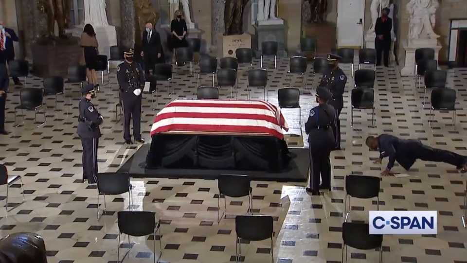 Ruth Bader Ginsburg's trainer, Army reservist Bryant Johnson, does a set of pushups while the former justice's body lay in state. (Photo: Twitter)