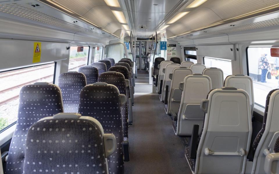 empty passenger seats on train - Kumar Sriskandan / Alamy Stock Photo