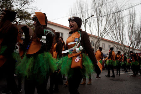 Carnival participants march during a parade in Torres Vedras, Portugal February 11, 2018. REUTERS/Pedro Nunes