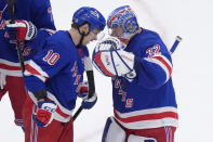 New York Rangers left wing Artemi Panarin (10) celebrates with goaltender Jonathan Quick (32) after defeating the Boston Bruins in an NHL hockey game, Thursday, March 21, 2024, in Boston. (AP Photo/Steven Senne)