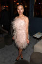 Wearing a feathery mini dress. <em>[Photo: Getty]</em>