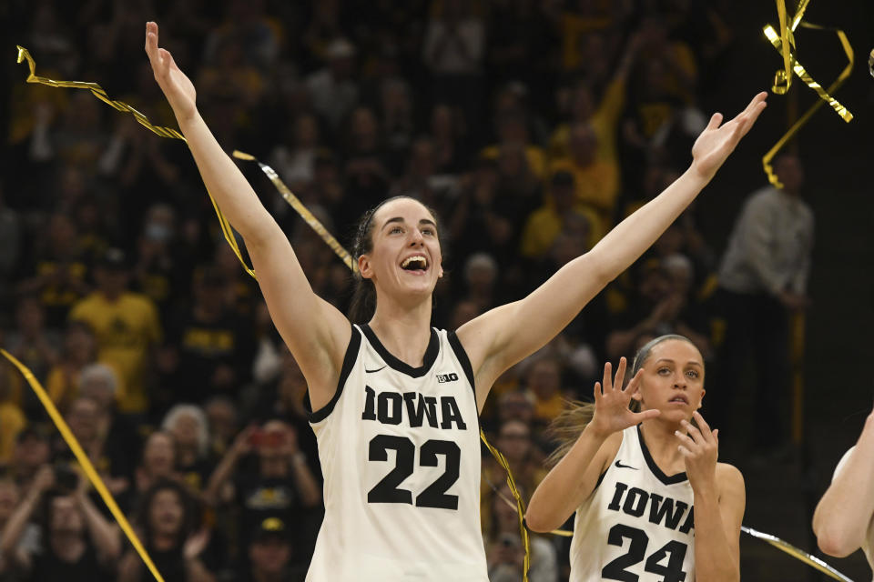 Iowa guard Caitlin Clark (22) looks on at the crowd during a home game in March. (AP Photo/Cliff Jette)