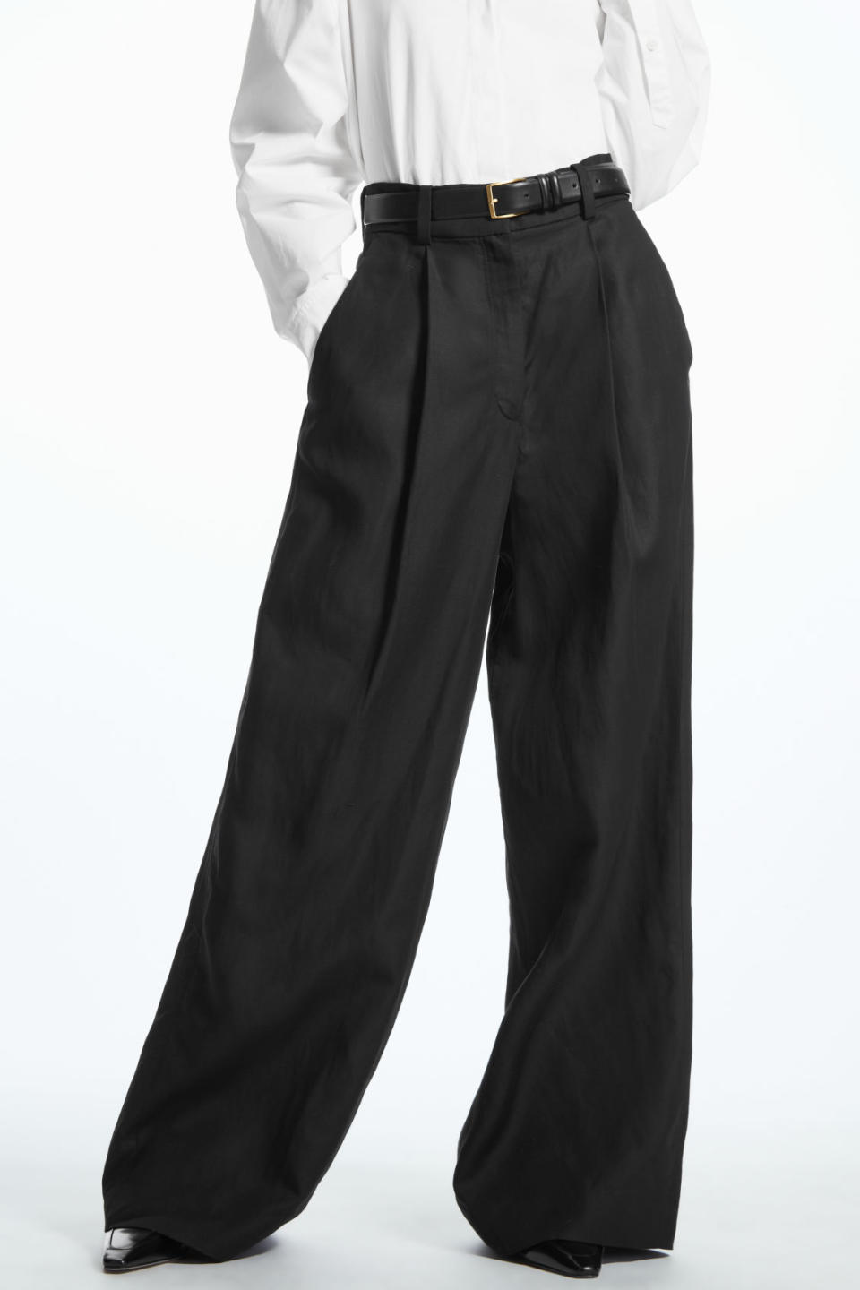 The trousers feature a flattering and elegant wide-leg silhouette. (Cos)