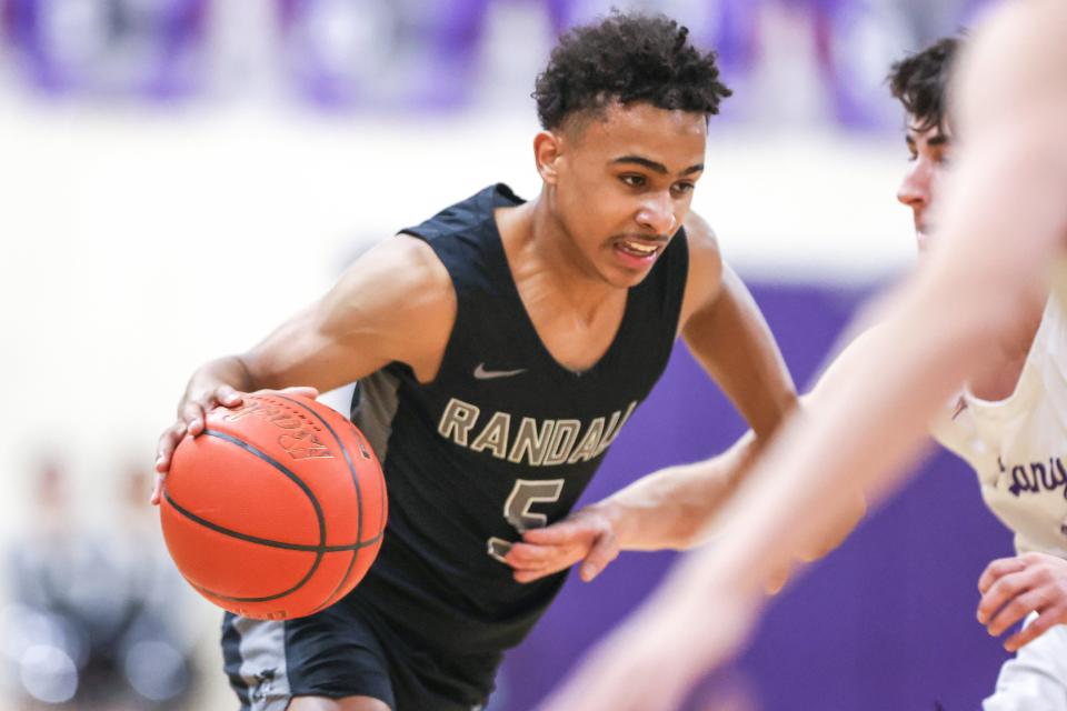 Randall’s KJ Thomas (5) drives for the basket in  a District 4-4A game against Canyon, Tuesday, January 31, 2023, at Canyon High School, Canyon, Tx.  Canyon won 62-47.