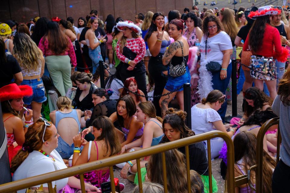 Fans of Harry Styles wait to enter his concert in New York City on August 21, 2022.