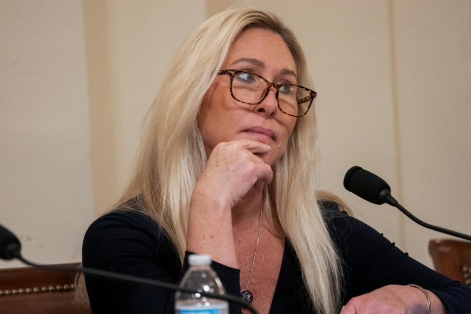 US Rep Marjorie Taylor Greene listens as fellow members speak during a House Homeland Security Committee meeting to vote on impeachment charges against Alejandro Mayorkas on Capitol Hill, 30 January 2024 (Reuters)