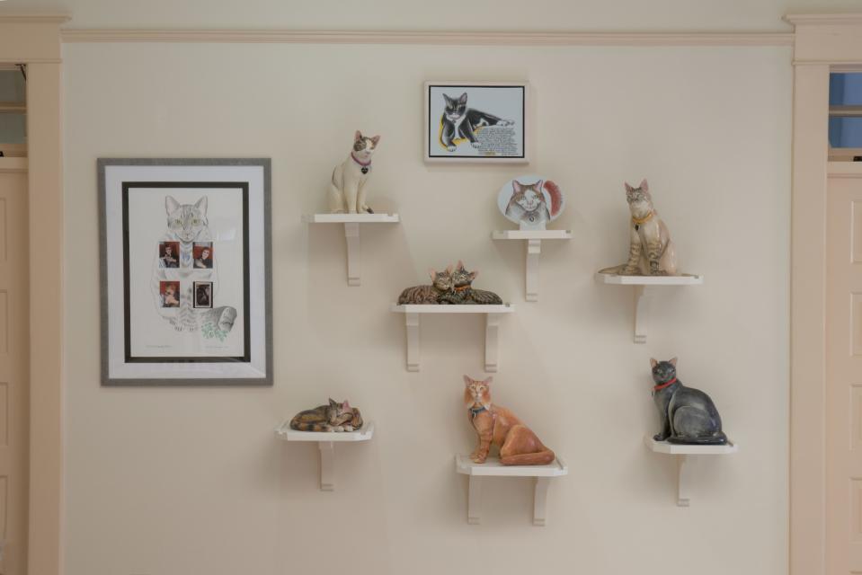 The cats of the Belen hotel. Woodman and Chicago have had up to seven cats at a time; currently, they number two. Chicago commemorates the passing of each with a ceramic statue.