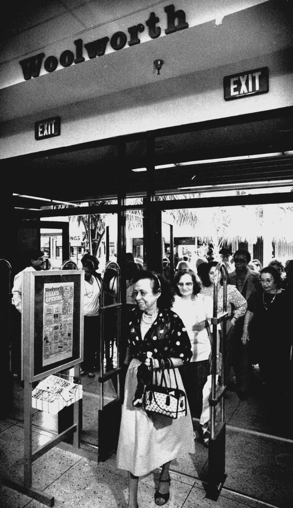 Woolworth downtown Miami store reopens in November 1990 after a fire. Elena Alonso was the first person into the store when it opened after a fire gutted the store in May. The store, which has been downtown since the 1930s, was back in business for the holidays much to the delight of people who shop downtown.