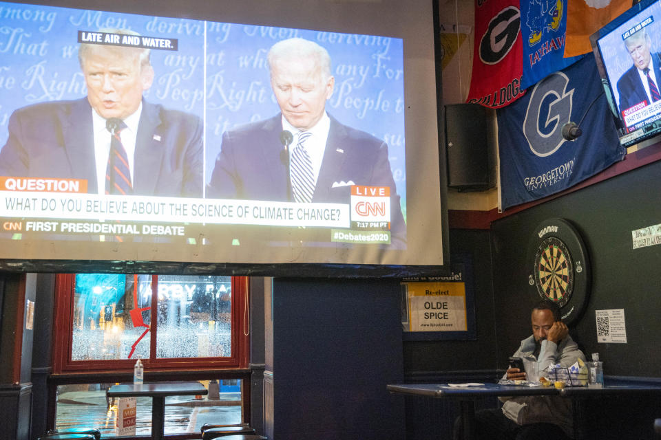 WASHINGTON, DC - SEPTEMBER 29: A man watches the first presidential debate at Nellie's Sports Bar on September 29, 2020 in Washington, United States. Americans across the country tuned in to the first presidential debate between Donald Trump and Joe Biden held in Cleveland. (Photo by Sarah Silbiger/Getty Images)