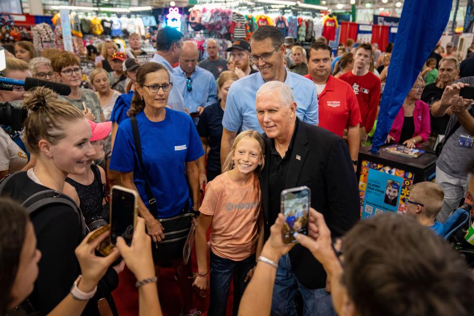 Former Vice President Mike Pence greets attendees during a visit to the Iowa State Fair, Friday, Aug. 19, 2022.