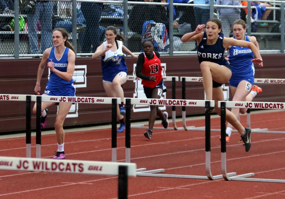 Gianna Lawrence of Chenango Forks, far right, won the 110-meter hurdles at the Southern Tier Athletic Conference track & field championships May 18, 2022 at Johnson City High School. Horseheads' Brenna O'Brien, far left, finished second.