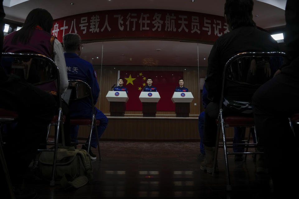 Chinese astronauts for the upcoming Shenzhou-18 mission Ye Guangfu, center, Li Guangsu, left, and Li Cong attend a meeting with the press at the Jiuquan Satellite Launch Center in northwest China, Wednesday, April 24, 2024. (AP Photo/Andy Wong)