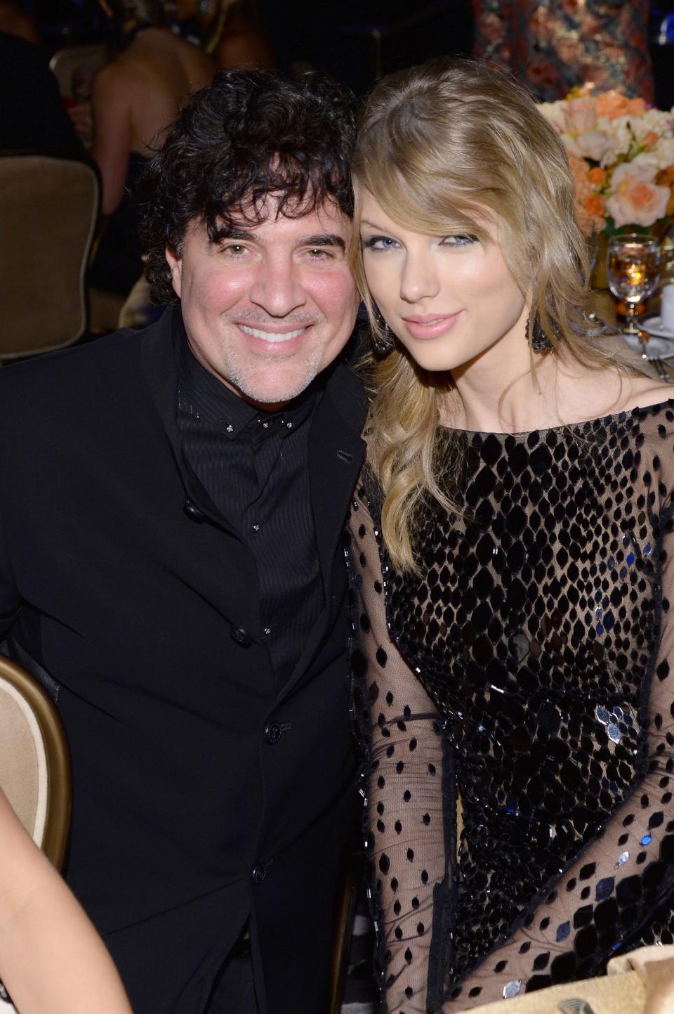 Taylor Swift and Scott Borchetta attend the 56th annual GRAMMY Awards  Pre-GRAMMY Gala and Salute to Industry Icons honoring Lucian Grainge at The Beverly Hilton on January 25, 2014.