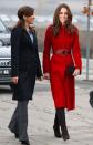 <p>Bold in a red L. K. Bennett coat and boots at a UNICEF Emergency Supply Center in Denmark</p>