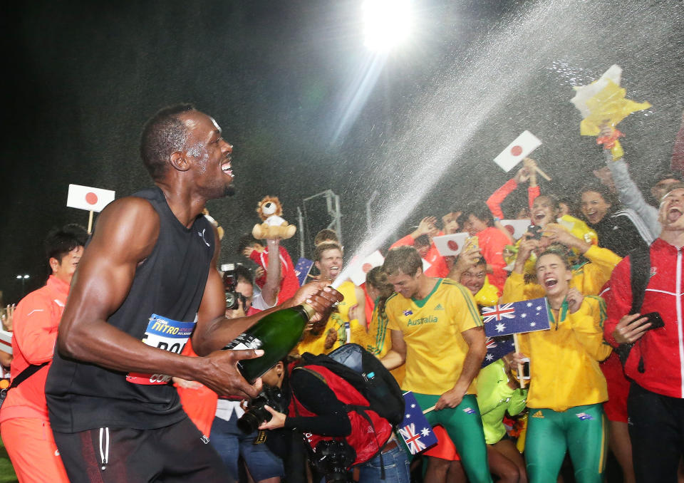 Usain Bolt of Usain Bolt's All-Star team sprays champagne on the teams after his team won the event during the Melbourne Nitro Athletics Series on February 11, in&nbsp;Melbourne, Australia. (Photo: Scott Barbour via Getty Images)