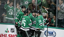 Dallas Stars forward Denis Gurianov, second from right, is congratulated by teammates after scoring a goal during the second period of an NHL hockey game against the Winnipeg Jets on Thursday, Dec. 5, 2019, in Dallas. (AP Photo/Brandon Wade)