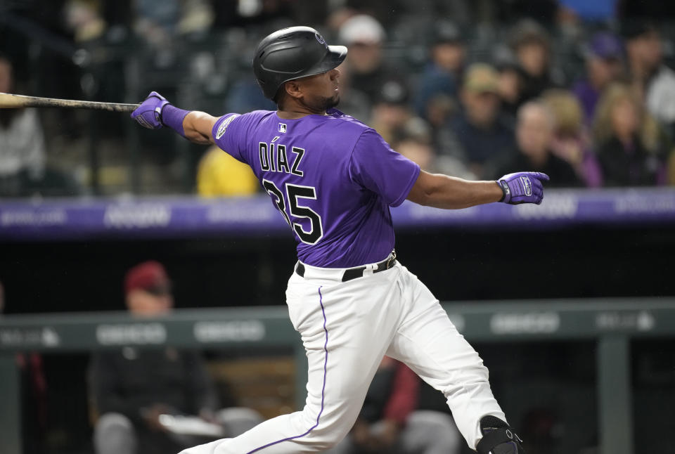 Colorado Rockies' Elias Diaz watches his two-run home run off Arizona Diamondbacks starting pitcher Zach Davies during the second inning of a baseball game Friday, Sept. 9, 2022, in Denver. (AP Photo/David Zalubowski)