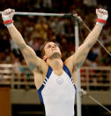 ATHENS - AUGUST 18: Paul Hamm of the USA celebrates after the horizontal bar at the men's artistic gymnastics individual competition on August 18, 2004 during the Athens 2004 Summer Olympic Games at the Olympic Sports Complex Indoor Hall in Athens, Greece. (Photo by Donald Miralle/Getty Images)