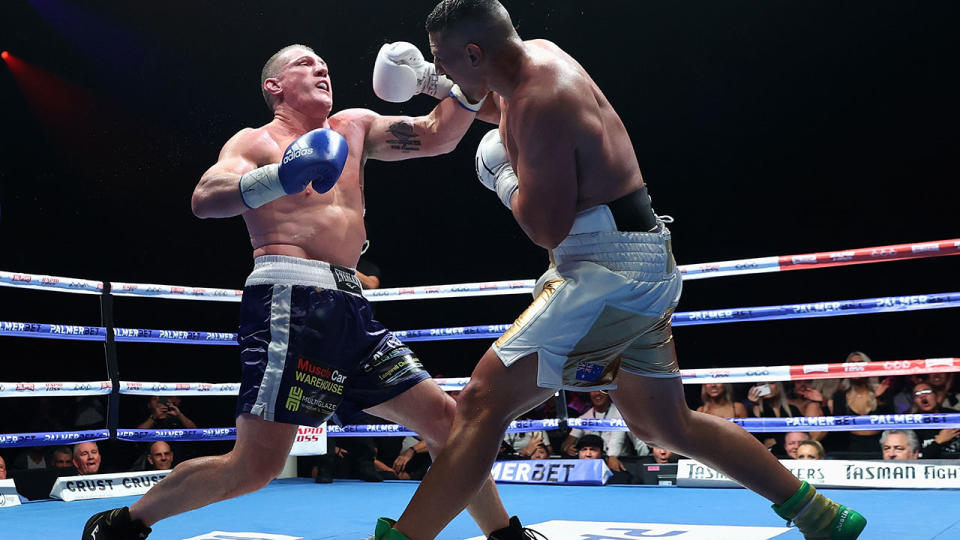 Justis Huni, pictured here knocking Paul Gallen to the canvas in their Australian heavyweight title fight.