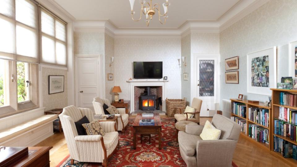 Another living room with a fireplace - Credit: Strutt & Parker