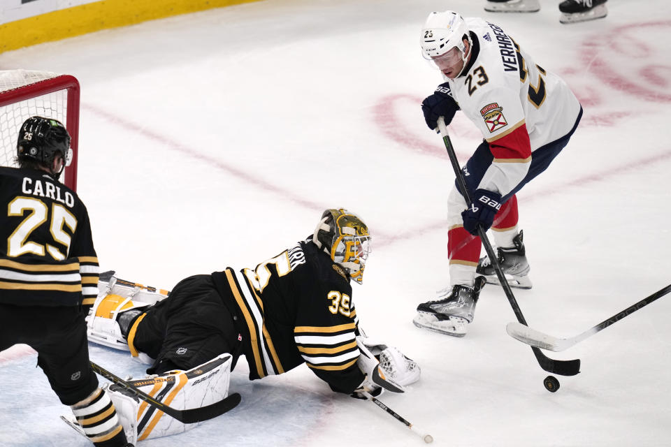 Boston Bruins goaltender Linus Ullmark (35) drops to make a save against Florida Panthers center Sam Reinhart (13) during the first period of an NHL hockey game, Monday, Oct. 30, 2023, in Boston. (AP Photo/Charles Krupa)