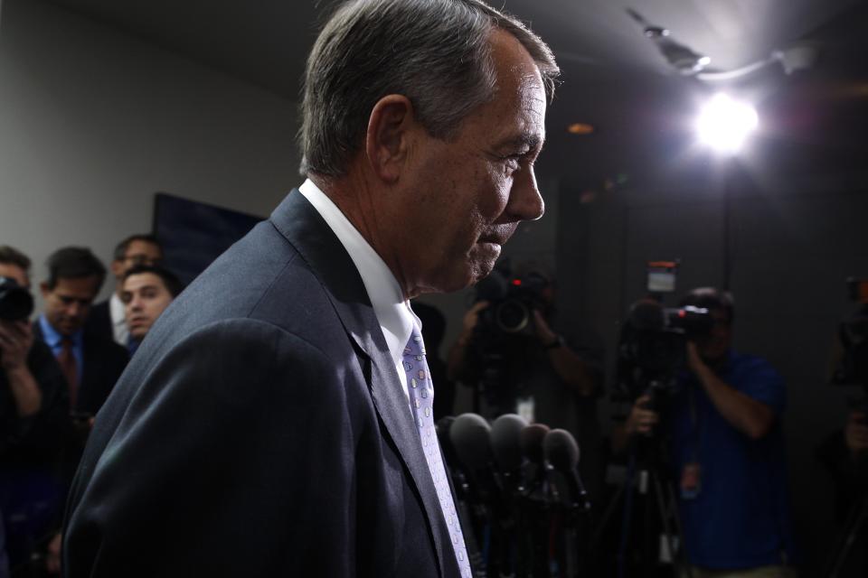 Boehner departs after a closed-door meeting of the House Republican caucus during a rare Saturday session at the U.S. Capitol in Washington