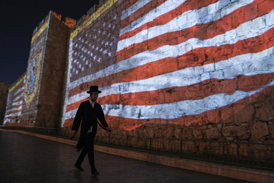 FILE - An image of the U.S. flag is projected on the walls of Jerusalem's Old City in honor of President Joe Biden's visit to Jerusalem, Wednesday, July 13, 2022. Several U.S. Jewish leaders are sounding alarms about what they see as a threat to Israel’s democracy posed by its new government, the Likud party led by Benjamin Netanyahu who took office in December 2022, fearing it will erode the independence of its judiciary and legal protections for minority groups. (AP Photo/Mahmoud Illean, File)