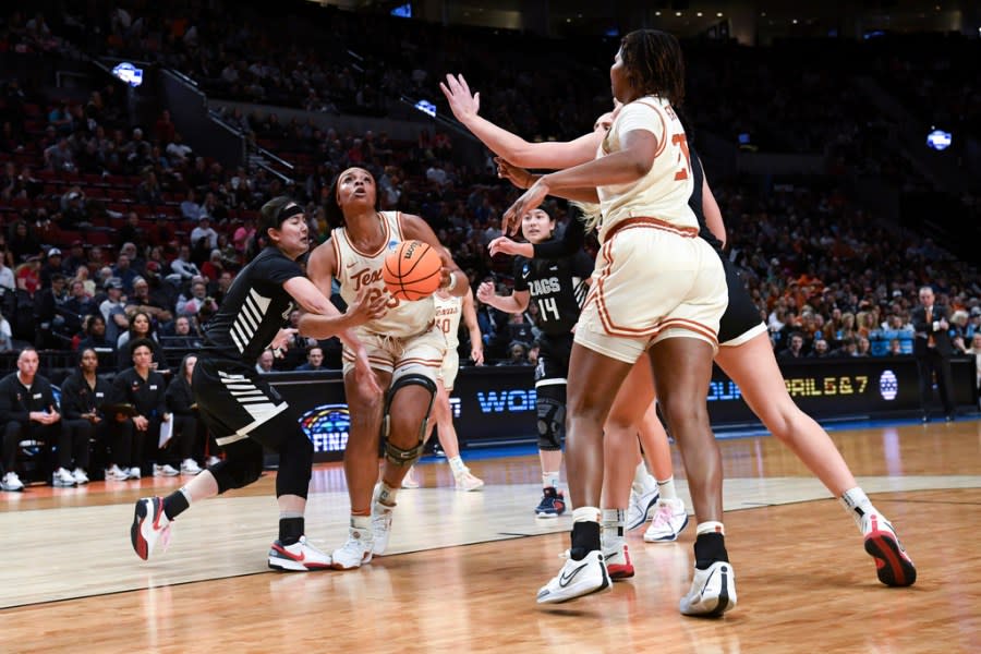 Texas forward Aaliyah Moore (23) looks to shoot against Gonzaga during the first half of a Sweet 16 college basketball game in the women’s NCAA Tournament, Friday, March 29, 2024, in Portland, Ore. (AP Photo/Steve Dykes)