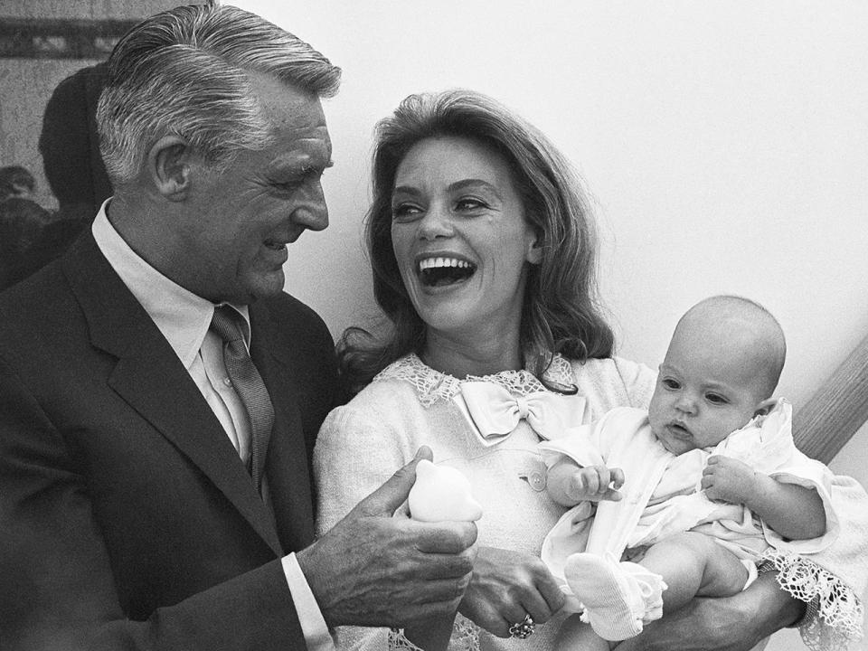 Cary Grant in 1966 with wife Dyan Cannon and their three-month-old daughter Jennifer, just before boarding the SS Oriana bound for England to visit Grant's mother. / Credit: Bettmann via Getty Images