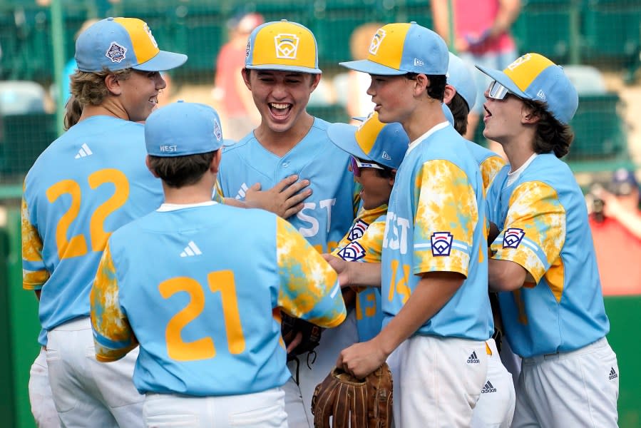 El Segundo, Calif.’s Louis Lappe, center, celebrates with Crew O’Connor (21), Jaxon Kalish (22), Max Baker (13), Brody Brooks (14) and Ollie Parks, right, after their 6-1 win against Needville, Texas during the United States Championship baseball game at the Little League World Series tournament in South Williamsport, Pa., Saturday, Aug. 26, 2023. (AP Photo/Tom E. Puskar)