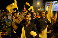 Supporters of Maldives' opposition presidential candidate Ibrahim Mohamed Solih celebrate their victory in Male, Maldives, Monday, Sept. 24, 2018. A longtime but little-known lawmaker Solih declared victory at his party's campaign headquarters in the capital city Male in a contentious election widely seen as a referendum on the island nation's young democracy. (AP Photo/Eranga Jayawardena)