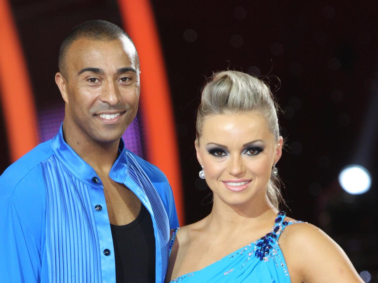 Colin Jackson (L) and Ola Jordan attend a photocall ahead of the Strictly Come Dancing Live Tour 2011 at Nottingham Capital FM Arena on January 14, 2011 in Nottingham, England. (Photo by Michelle Moore/WireImage)