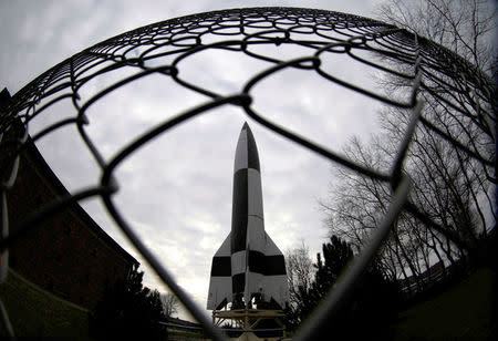 FILE PHOTO: A prototype of a 'Vengeance Weapon 2' or 'V2' rocket is pictured next to the entrance to an exhibition in Peenemuende, Germany, March 7, 2008. To Match Special Report USA-NUCLEAR/ICBM REUTERS/Tobias Schwarz/File Photo