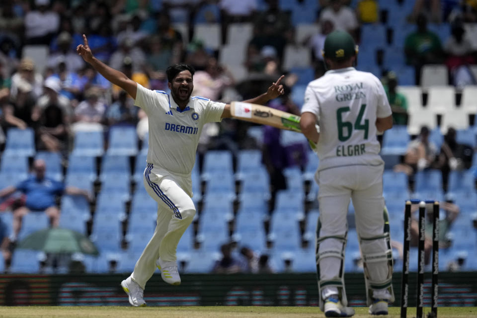 India's bowler Shardul Thakur, left, celebrates after dismissing South Africa's batsman Dean Elgar for 185 runs during the third day of the Test cricket match between South Africa and India, at Centurion Park, in Centurion, on the outskirts of Pretoria, South Africa, Thursday, Dec. 28, 2023. (AP Photo/Themba Hadebe)