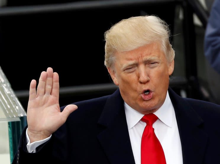 President Trump takes the oath of office during his inauguration at the U.S. Capitol. (Photo: Kevin Lamarque/Reuters)