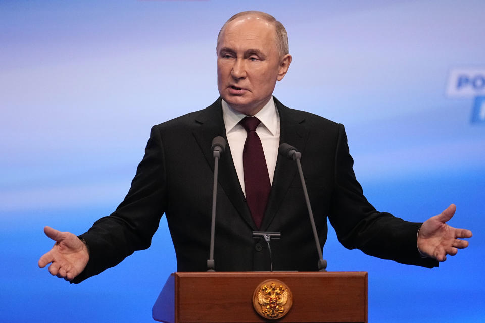 Russian President Vladimir Putin gestures while speaking on a visit to his campaign headquarters after a presidential election in Moscow, Russia, early Monday, March 18, 2024. (AP Photo/Alexander Zemlianichenko)