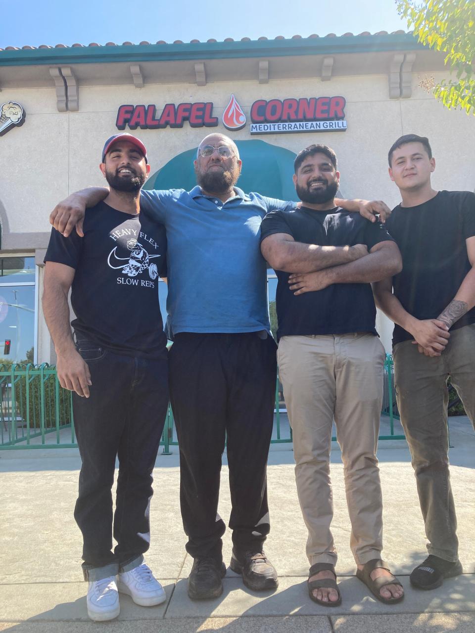 Grand opening: Left to right, Mohamed "Zeb" Shahzaib, Sajad Shakoor, Mohamad Sikandar and Eric Anguiano stand in front of the new Falafel Corner in Discovery Village in Redding.