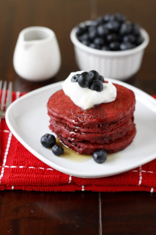 Red Velvet Pancakes With Whipped Cream And Blueberries