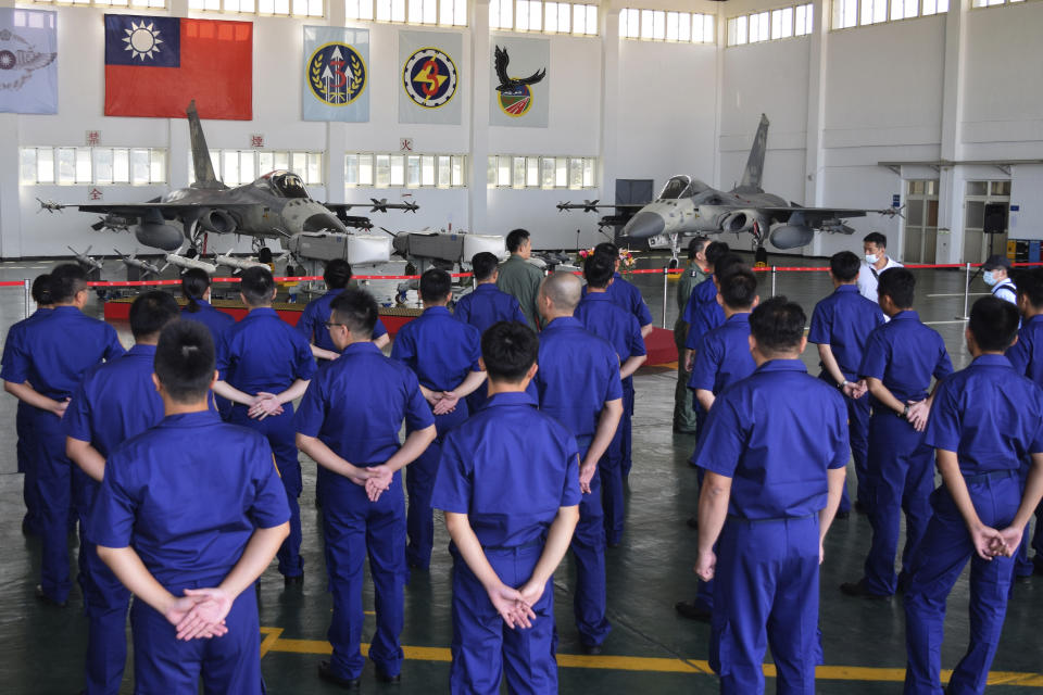 Taiwanese airmen gather during a visit by Taiwan President Tsai Ing-wen to the Penghu Magong military air base in outlying Penghu Island, Taiwan Tuesday, Sept. 22, 2020. Tsai visited the military base on one of Taiwan’s outlying islands Tuesday in a display of resolve following a recent show of force by rival China. (AP Photo/Wu Huizhong)