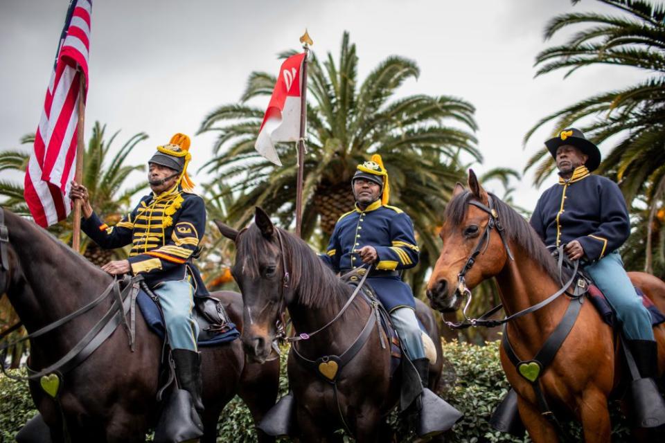Mounted Buffalo Soldiers delivered the presentation of colors before the start of a Memorial Day ceremony at the Los Angeles National Cemetery.