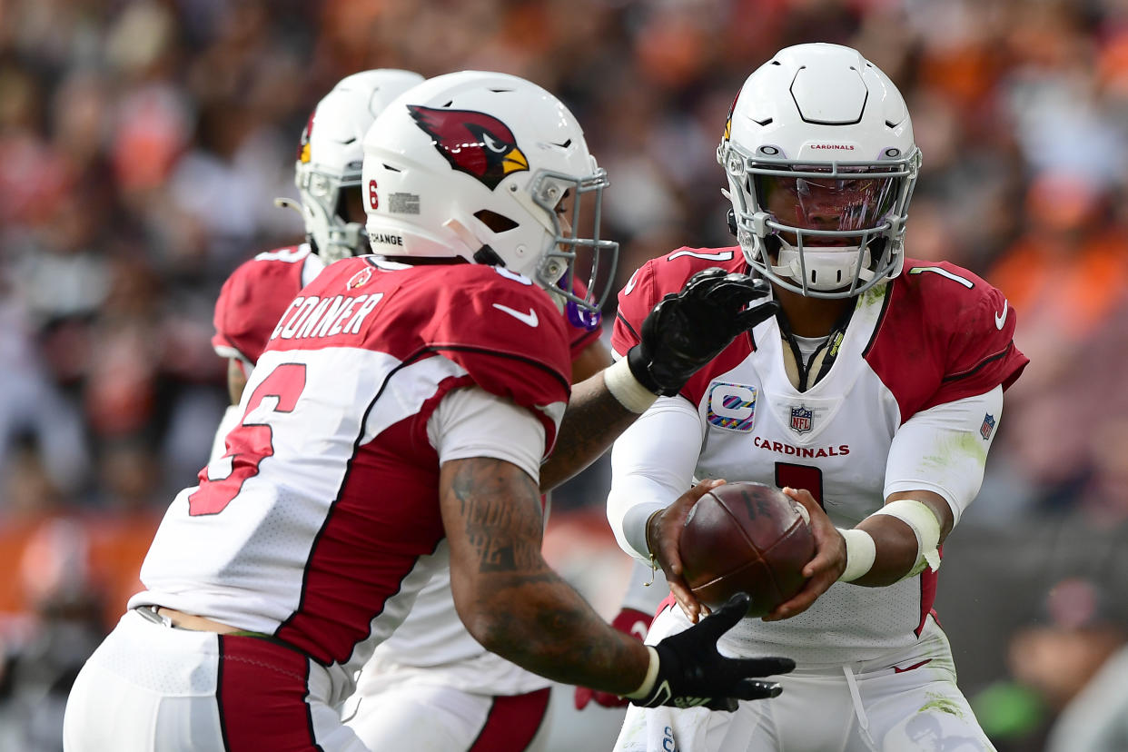Kyler Murray of the Arizona Cardinals hands the ball off to teammate James Conner during the first quarter against the Cleveland Browns on Oct. 17. (Emilee Chinn/Getty Images)
